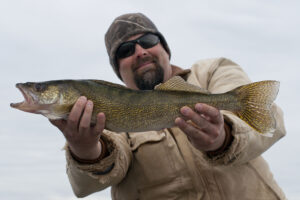 Man holding Walleye, Manitoba
