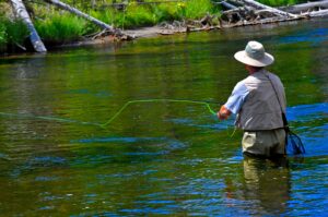 Man fly fishing, river Wyoming