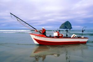 Dorey Boats, Cape Kiwanda, in shallow water on Oregon coast